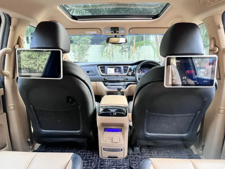 Kia Carnival interior with captain seats and rear screens