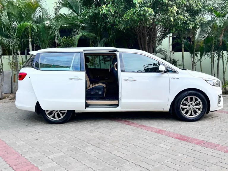 White Kia Carnival from the Sri Ram Cars fleet, Chennai