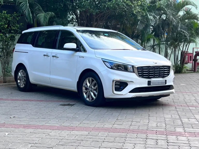 White Kia Carnival from the Sri Ram Cars fleet, Chennai