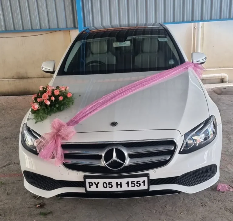 White Mercedes-Benz E-Class decorated for a wedding in Chennai
