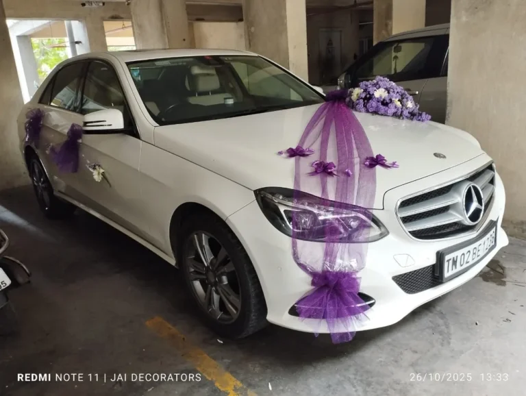 White Mercedes-Benz E-Class decorated for a wedding in Chennai