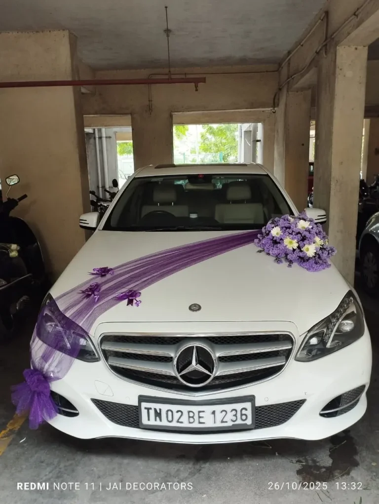 White Mercedes-Benz E-Class decorated for a wedding in Chennai