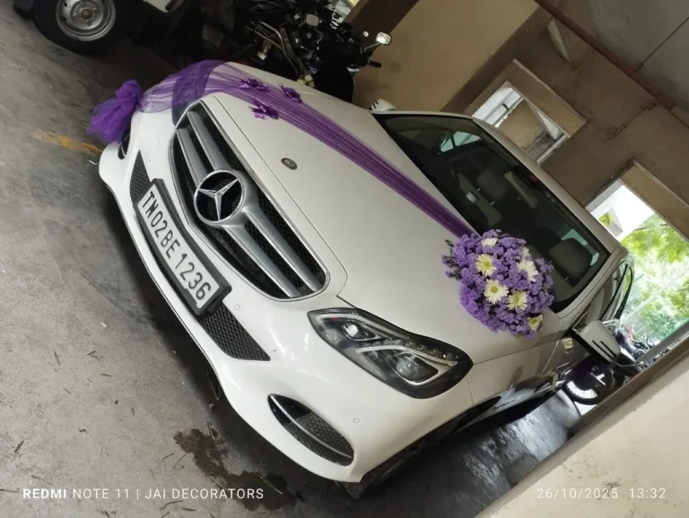 White Mercedes-Benz E-Class decorated for a wedding in Chennai